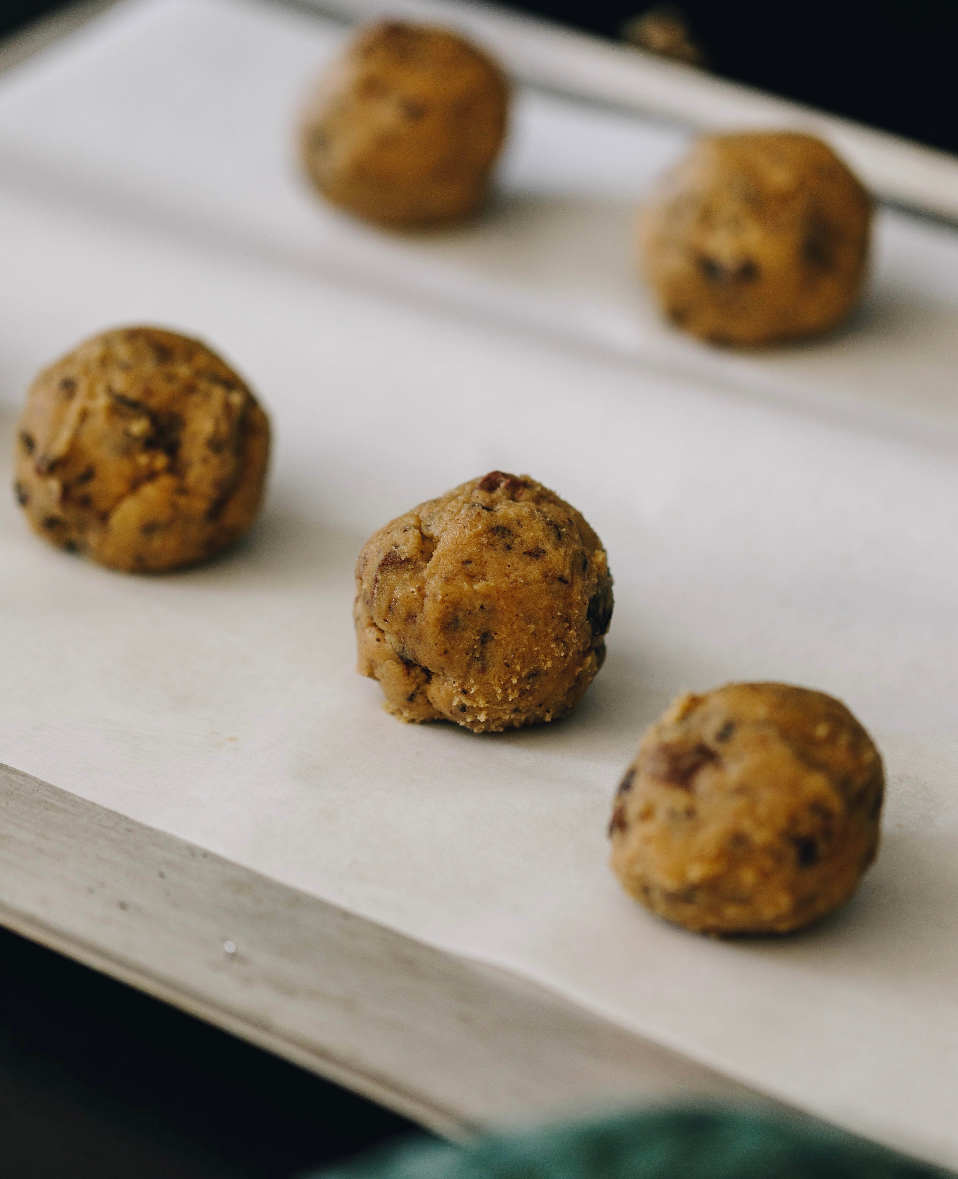 Dough balls on tray - cookies - The Dough-ctor baked goods - angled view